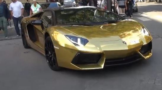 gold car aventador